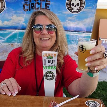 Full Circle Brewing Company - One of the amazingly friendly hostesses hands my a Juicy Vibe beer, straight from the tap. - Breweries Near Me - Fresno, California