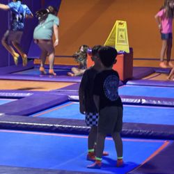 Altitude Trampoline Park at Cityview - Caution sign just on top of a broken podium ..