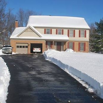 Twin Cities Landscaping Services - a driveway in the snow - Landscaping Near Me