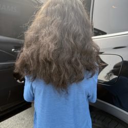 Refresh Hair Studio - Uneven cut with bulky ends and obvious long strands sticking out.
