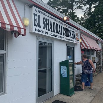 Shaddai Chicken - a woman standing outside of a restaurant - Mexican Near Me - Manteo, North Carolina Shaddai Chicken - a woman standing outside of a restaurant - Mexican Near Me - Manteo, North Carolina