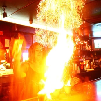 Long Branch Saloon - a fire being lit by a bartender - Pubs Near Me - Bakersfield, California