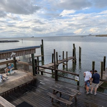 Pelican Pub - Outside. View from the back patio. This faces north, northwest towards Bayou Aloe and Alabama's Coastal Connection. - Pubs Near Me - Dauphin Island, Alabama Pelican Pub - Outside. View from the back patio. This faces north, northwest towards Bayou Aloe and Alabama's Coastal Connection. - Pubs Near Me - Dauphin Island, Alabama