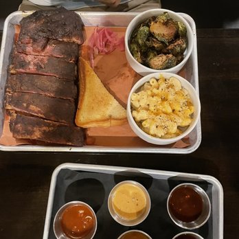 Prohibition Dunedin - 1/2 rack ribs, Mac and cheese side, brown butter Brussels sprouts, barbecue sauce flight - Gastropubs Near Me - Dunedin, Florida