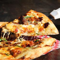 Flying Heart Brewing & Pub - The Ribeye Pizza! Our November monthly special with steak, scalloped potatoes, crispy bacon, feta cheese, cheddar cheese, and fresh rosemary
