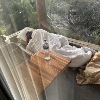 Marival Armory - A woman sleeping on the balcony - Resorts Near Me - Punta Mita, NAY