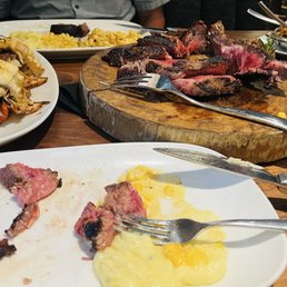 Tomahawk steak, lobster tail, garlic mashed potatoes, creamed corn, macaroni. Tomahawk steak, lobster tail, garlic mashed potatoes, creamed corn, macaroni.