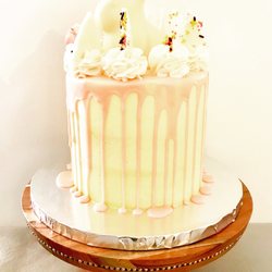 Kohana Cakes - Easter cake, lemon with white chocolate drip and chocolate Easter-themed chocolate chards on mounds of buttercream