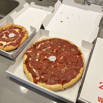 Pizza Cellar - Large deep dish with sausage and small cheese pizza - Pizza Near Me - Crown Point, Indiana Pizza Cellar - Large deep dish with sausage and small cheese pizza - Pizza Near Me - Crown Point, Indiana
