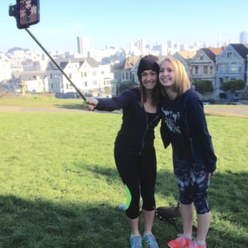 Alamo Square - some lady thought it would be cool to take a picture of us taking a picture on my selfie stick (; haha - Parks Near Me - San Francisco, California