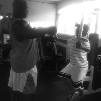 BFit Training Studio - Brian showing my dad how to use the machine - Weight Loss Centers Near Me - Honolulu, Hawaii