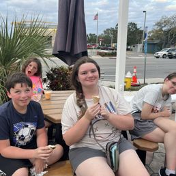 Happy children, except the one waiting for her cone. Happy children, except the one waiting for her cone.