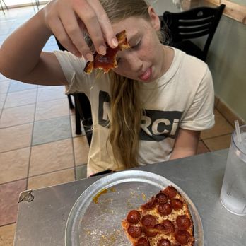 NB's Wicked Bah Pizza - Teen with her happy belly. - Pizza Near Me - New Braunfels, Texas NB's Wicked Bah Pizza - Teen with her happy belly. - Pizza Near Me - New Braunfels, Texas