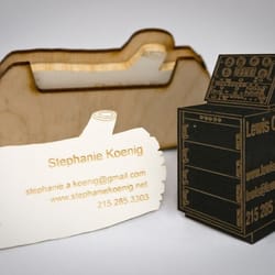 NextFab - Two examples of laser-cut business cards (plus a carrying case), demonstrated in our Custom-Cut Business Cards class