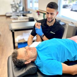 ProClinix Sports Physical Therapy & Chiropractic - Tarrytown NY - Dr Michael Donnelly, DPT, PT, CSCS providing manual treatment for this rotator cuff repair patient