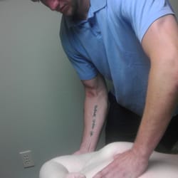 Pro's Choice Massage Support Services - Dave Guthrie, LMT stretches a client during a typical Pro's Choice massage session.