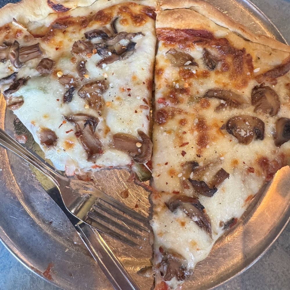 2 slices of Veggie Pizza ! Cooked to perfection. 2 slices of Veggie Pizza ! Cooked to perfection.