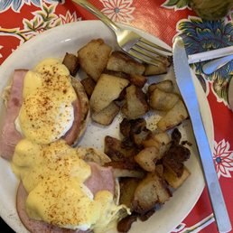 Eggs Benedict and hash browns. Eggs Benedict and hash browns.