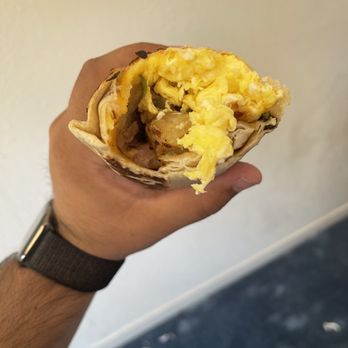 Original Pollo - a hand holding a burrito - American Near Me - Berkeley, California