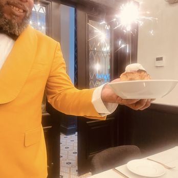 Proper Cuisine - Forest delivering the birthday sparkler - American Near Me - Baltimore, Maryland