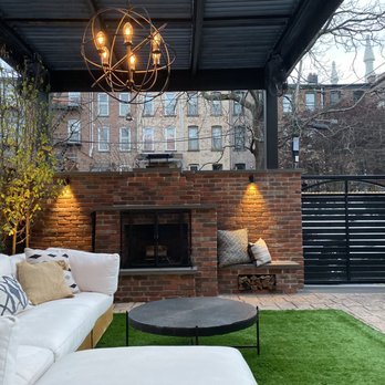 Green City Design - Jersey City Brownstone w/ custom fireplace, pergola, horizontal cedar fencing, artificial grass, and fiberglass planter boxes. - Landscape Architects or Designers Near Me Green City Design - Jersey City Brownstone w/ custom fireplace, pergola, horizontal cedar fencing, artificial grass, and fiberglass planter boxes. - Landscape Architects or Designers Near Me