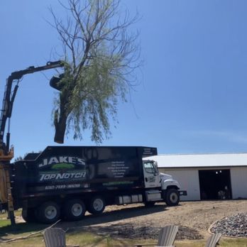 Jake's Top Notch Tree Service - Loading whole tree in grapple truck - Tree Services Near Me - Princeton, Minnesota Jake's Top Notch Tree Service - Loading whole tree in grapple truck - Tree Services Near Me - Princeton, Minnesota