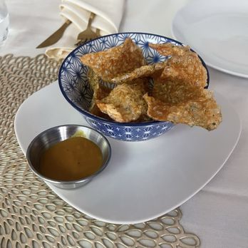 Coarse by Chef Reginald Scott - House made pork rinds with hot sauce - Smokehouse Near Me - Houston, Texas