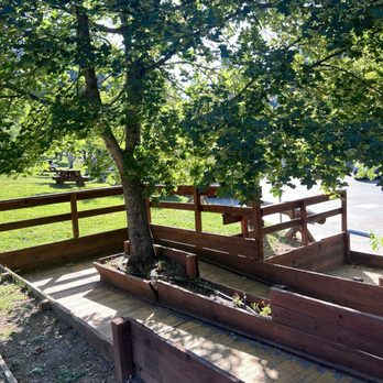 Rainbow Orchards - Walk way in between the building and grassy seating areas. - Fruits & Veggies Near Me - Camino, California Rainbow Orchards - Walk way in between the building and grassy seating areas. - Fruits & Veggies Near Me - Camino, California