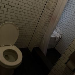 Filthy shared bathroom When I paid for a private bath. Filthy shared bathroom When I paid for a private bath.