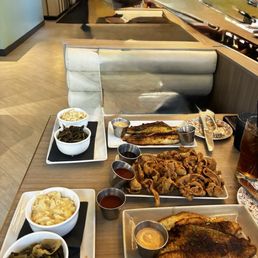 Blackened catfish, mac & cheese, collard greens , fried chicken skins . Blackened catfish, mac & cheese, collard greens , fried chicken skins .