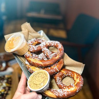 SouthEnd Brewing - a person holding a box of pretzels - Breweries Near Me - Greensboro, North Carolina SouthEnd Brewing - a person holding a box of pretzels - Breweries Near Me - Greensboro, North Carolina