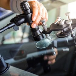 Mr. Auto Glass - Injecting resin into a rock chip. Chips smaller than a quarter can usually be repaired in about 30 minutes at your location.