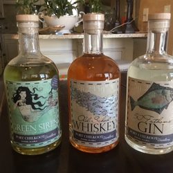 Brown Jug Famous Liquor Stores - Port Chilkoot Green Siren Absinthe, Old School Whiskey and 50 Fathoms Gin.