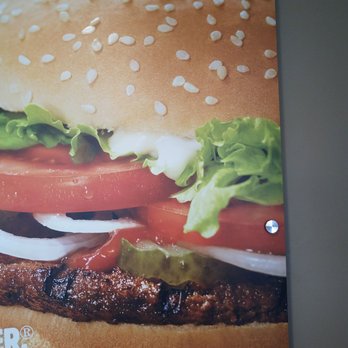 Burger King - a hamburger with lettuce, tomato, and onions - Burgers Near Me - Lake Delton, Wisconsin