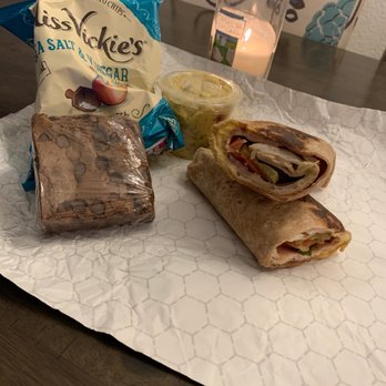 Roly Poly - a sandwich and chips on a table - Delis Near Me - Dallas, Texas Roly Poly - a sandwich and chips on a table - Delis Near Me - Dallas, Texas