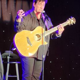 Gordie playing guitar while singing like .........many performers