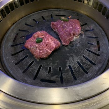 Stone Age Korean BBQ - Cooking the meat - Korean Near Me - Huntsville, Alabama Stone Age Korean BBQ - Cooking the meat - Korean Near Me - Huntsville, Alabama