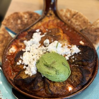 Art Cafe of Nyack - Shakshooka - 2 eggs baked in spicy tomato sauce topped with bulgarian feta and mediterranean herbs; served with pita on side ($18) - Coffee & Tea Near Me - Nyack, New York Art Cafe of Nyack - Shakshooka - 2 eggs baked in spicy tomato sauce topped with bulgarian feta and mediterranean herbs; served with pita on side ($18) - Coffee & Tea Near Me - Nyack, New York