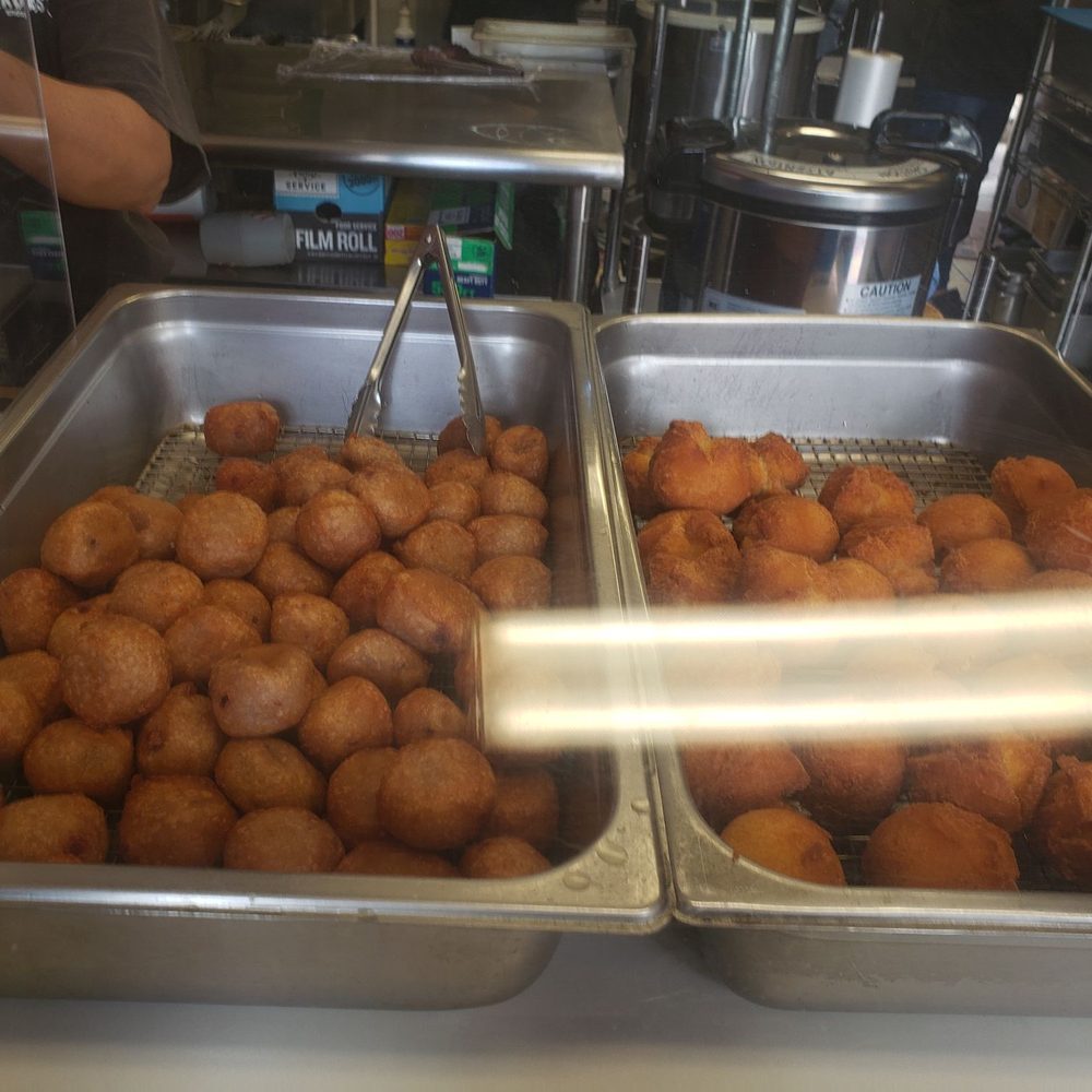 Teruya's Andagi - Sweet Potato Mochi ($0.80 per piece) on da left, Andagi ($1.00 per piece) on da right. - Japanese Near Me - Honolulu, Hawaii