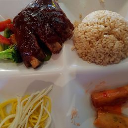 ENJOYING Amber baby-back ribs on a bed of veggies,  spring rolls, brown rice + starters of miso soup & salad. Lunch price: $11.50.