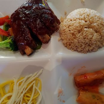 Amber - ENJOYING Amber baby-back ribs on a bed of veggies,  spring rolls, brown rice + starters of miso soup & salad. Lunch price: $11.50. - Japanese Near Me - New York, New York