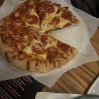 The Wright Place - a pepperoni pizza with a slice missing - American Near Me - Willoughby Hills, Ohio