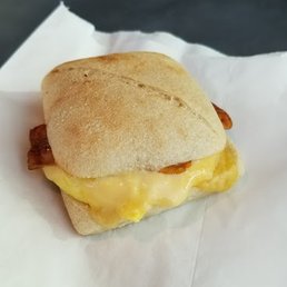 Bacon, egg, and gouda breakfast sandwich thing. Delicious. Bacon, egg, and gouda breakfast sandwich thing. Delicious.