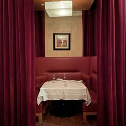 Ciera Steak + Chophouse - Cute private booths with luxe red drapes. So romantic!