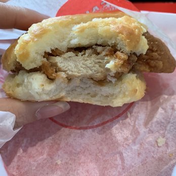 Jack's Family Restaurant - a hand holding a half eaten sandwich - Fast Food Near Me - Columbus, Mississippi