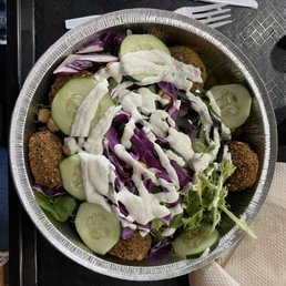 a bowl of salad with dressing