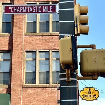 Baltimore Visitor Center - The Iconic "Charm'tastic Mile" Street Sign at the corner of W Pratt & Greene Street. - Visitor Centers Near Me - Baltimore, Maryland Baltimore Visitor Center - The Iconic "Charm'tastic Mile" Street Sign at the corner of W Pratt & Greene Street. - Visitor Centers Near Me - Baltimore, Maryland