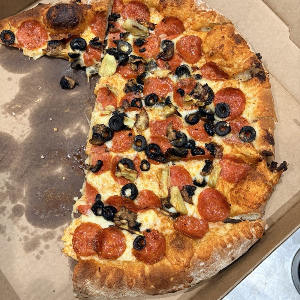Suds Monkey Kitchen & Brewery Dripping Springs - Pepperoni, black olives, mushrooms, garlic, extra cheese - Brewpubs Near Me - Austin, Texas