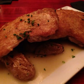 Salty Sow - Crispy chicken thighs with smashed fingerling potatoes and neck gravy. - American Near Me - Austin, Texas