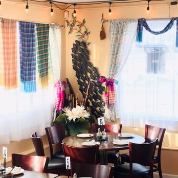 Thai Nation Bistro - a dining room with tables and chairs - Thai Near Me - Burton, Michigan Thai Nation Bistro - a dining room with tables and chairs - Thai Near Me - Burton, Michigan